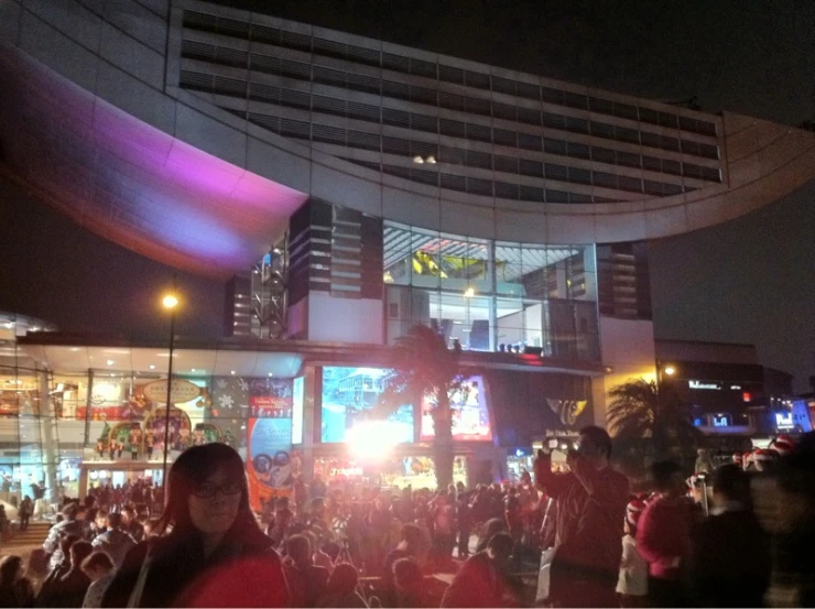 a crowd of people gathered outside an event venue