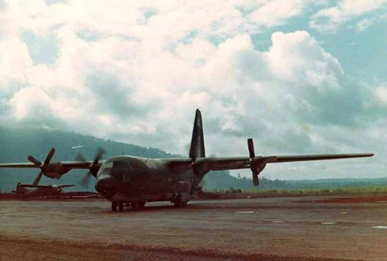 military planes parked on a runway in the mountains