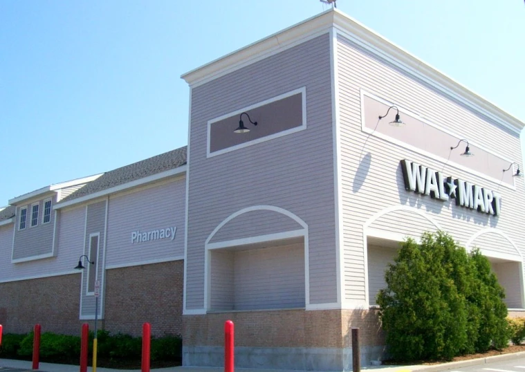 a parking lot and a very large gray building