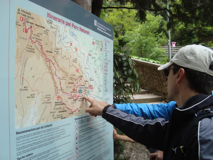 a man points to a map of a country