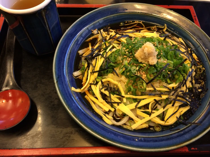 some vegetables are piled together on a plate