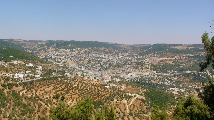 a view of some hills and some houses