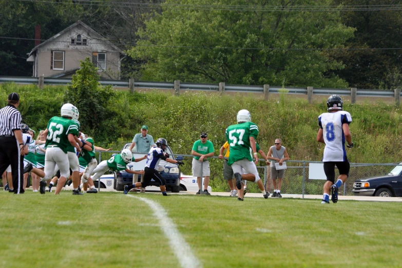 a group of men on a field playing football