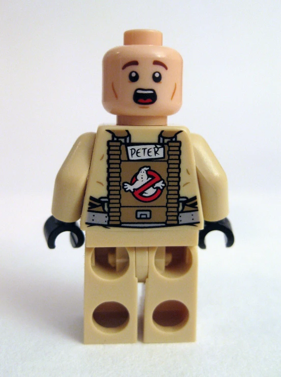 a lego figure with a piece of sticker taped to it's chest