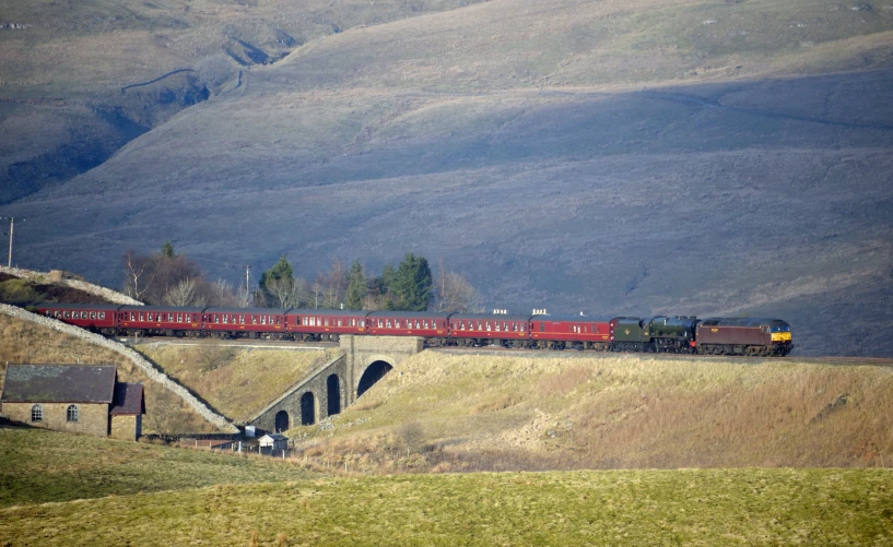 an image of a train that is going over a bridge