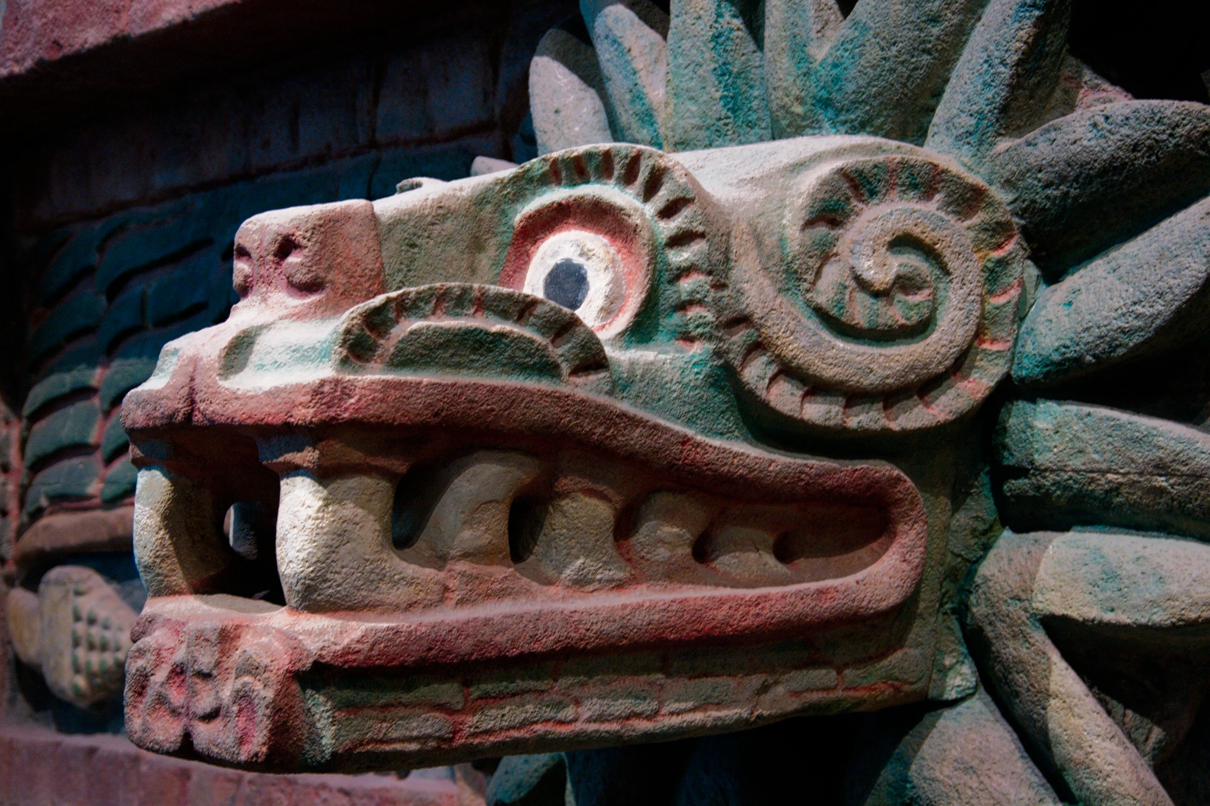 a carving of a dragon in stone on a building