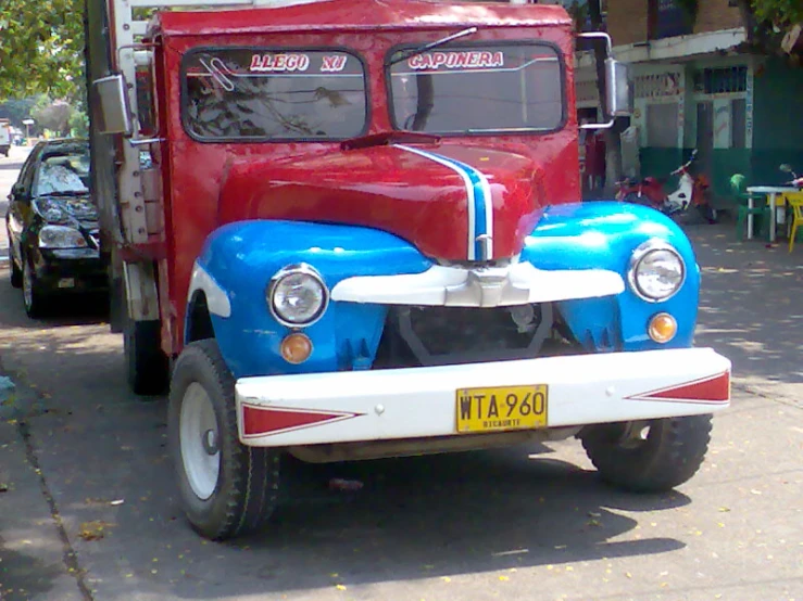 the truck is painted blue, white and red