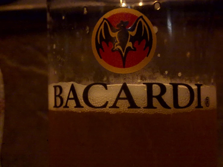 the bacardi logo is engraved on a beer bottle