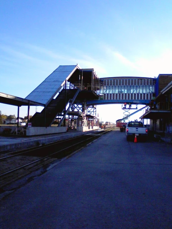 a truck drives along an empty train track