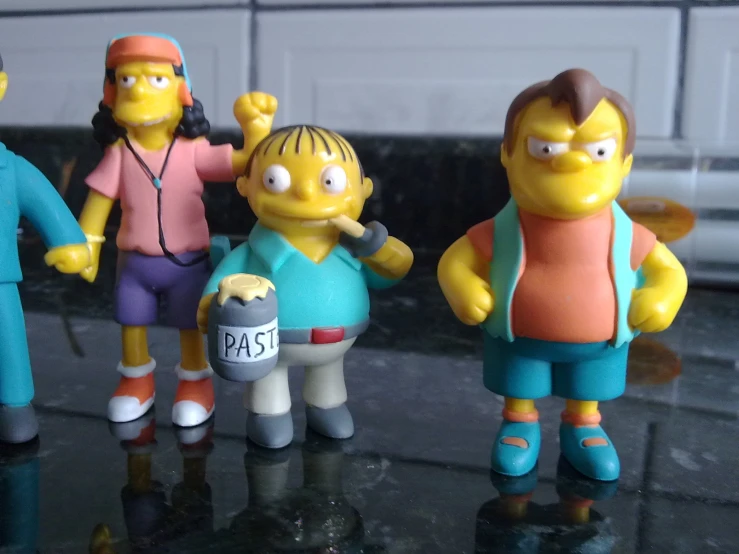 the simpsons toys are in the group that is on the counter