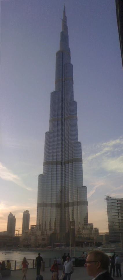 a very tall burj building standing on top of a tall building