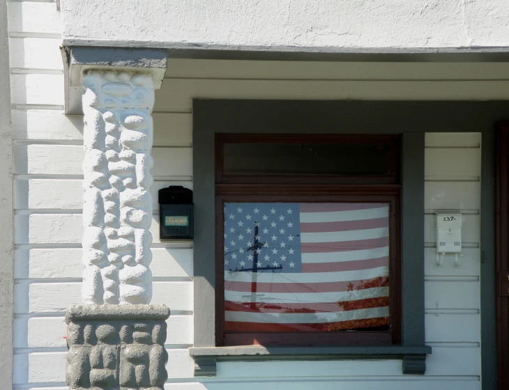 a building that has a flag on the front door