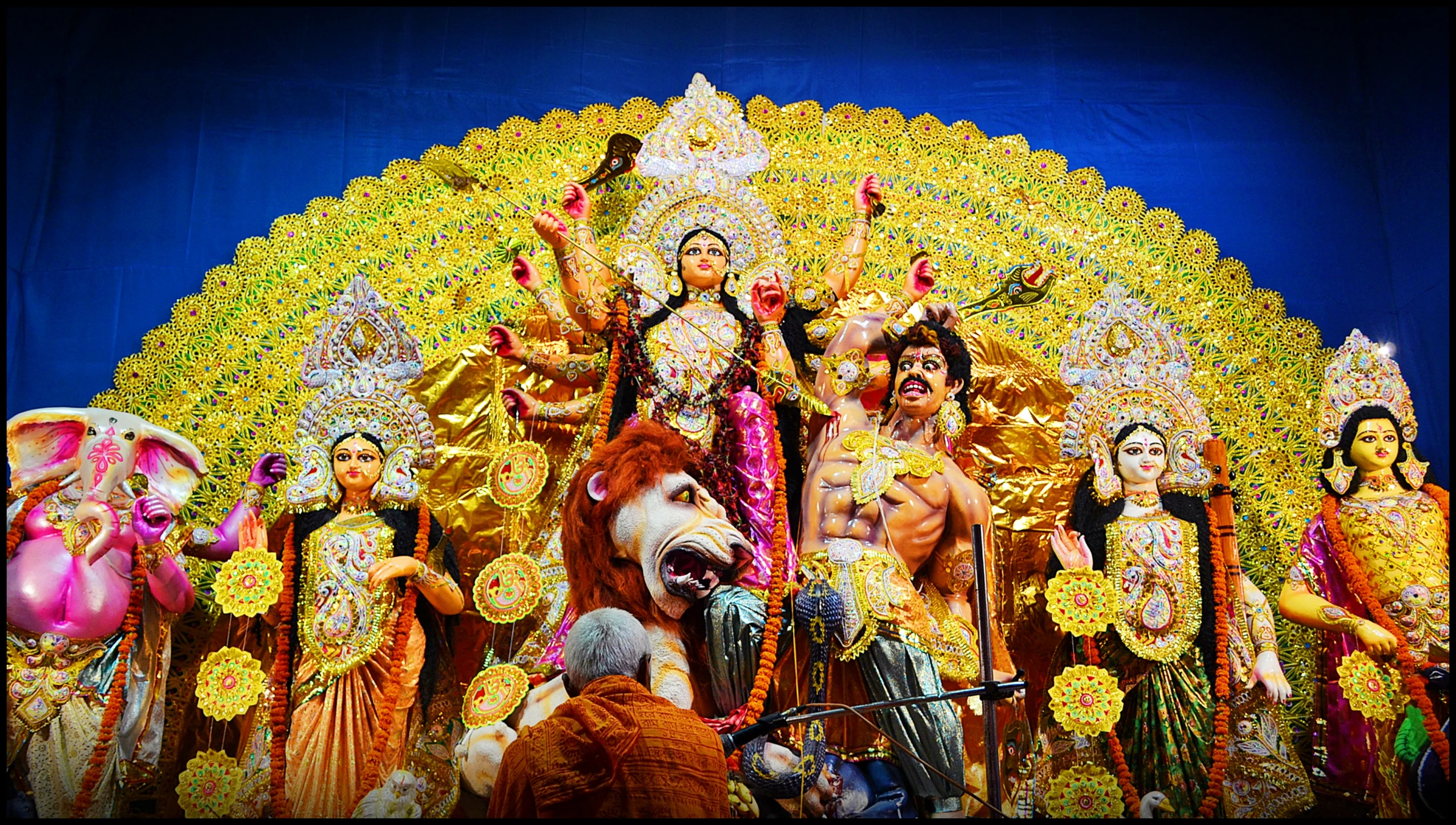 a display with dancers and a lion next to them