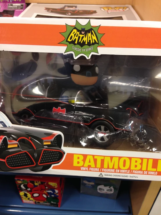a black batmobile toy with batman symbol on back