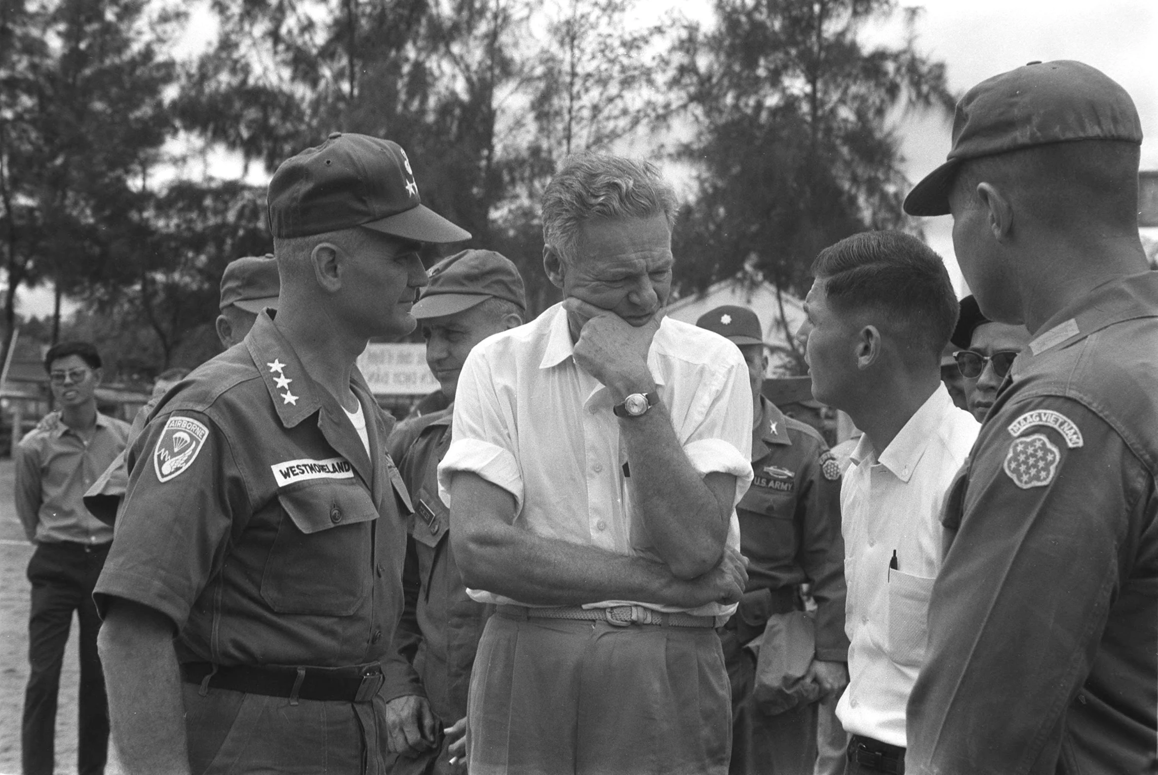 black and white po of men in military uniforms with arms crossed