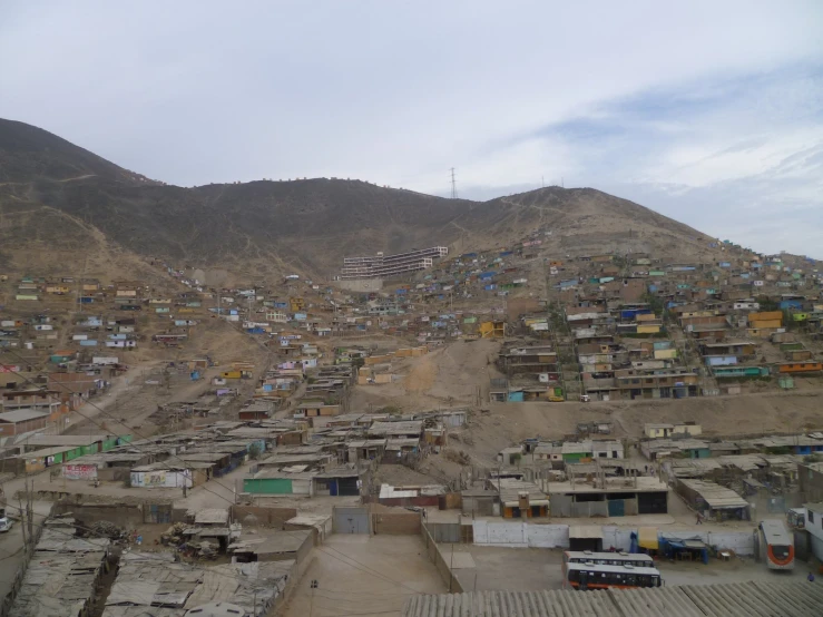 a village in the mountains with a mountain behind it