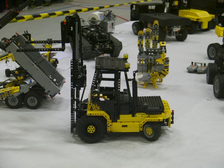 a group of lego vehicles are stacked next to each other