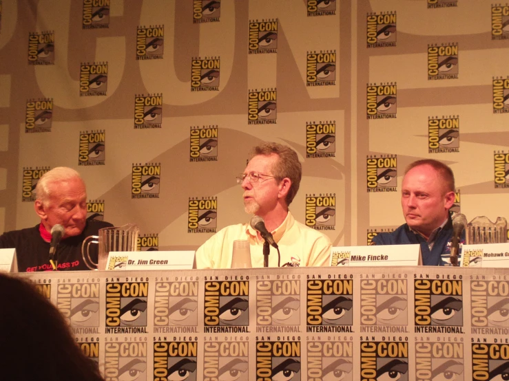 a table full of paneling at comic con 2013