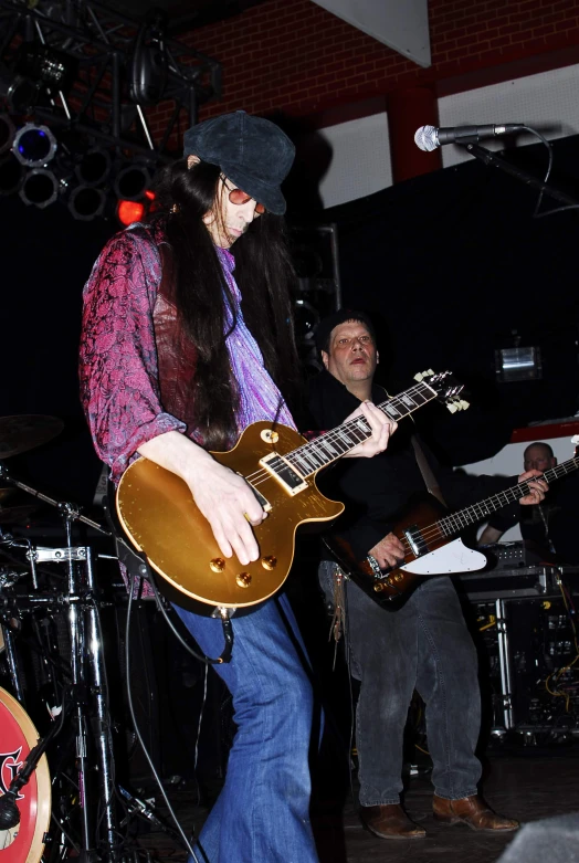 an image of a man playing an electric guitar