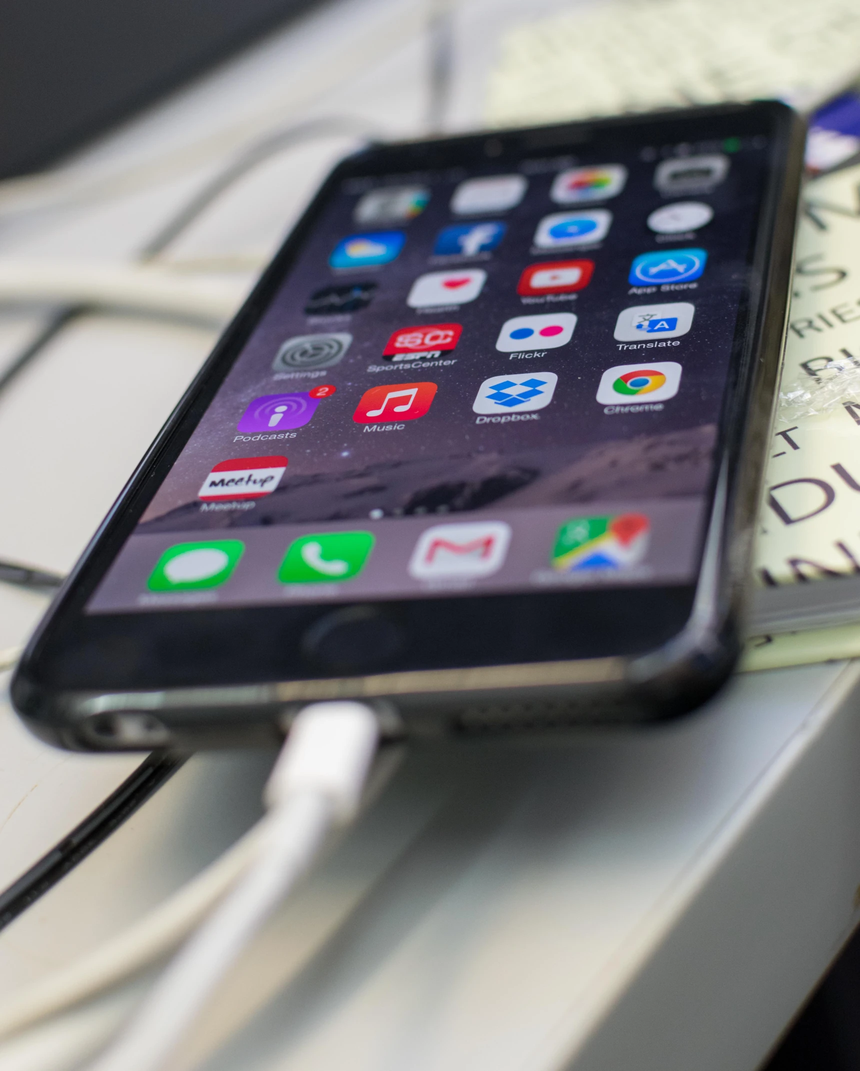 there is a phone that has a book on the table