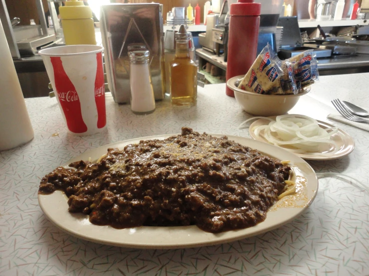 a table is full of  dogs and condiments