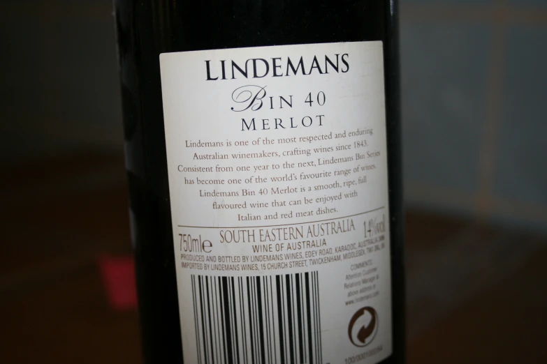 label of a bottle of wine with black tips