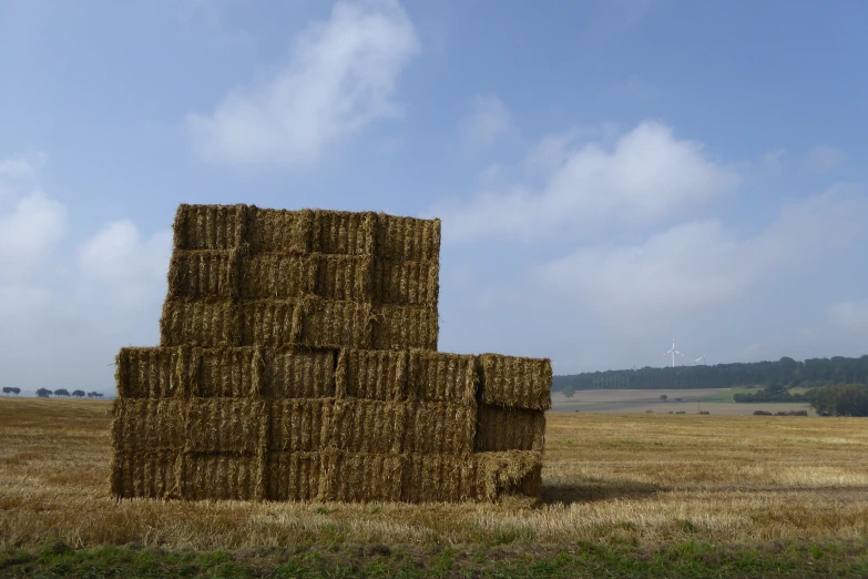 a hay bale in the middle of a field