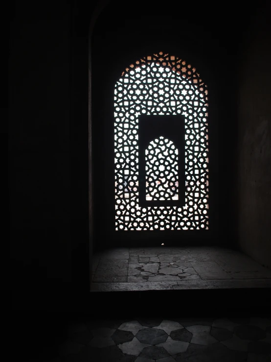 a door and light from inside an arch