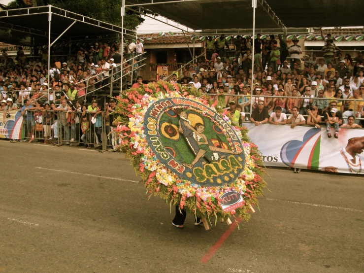 a man on a large parade board in a parade