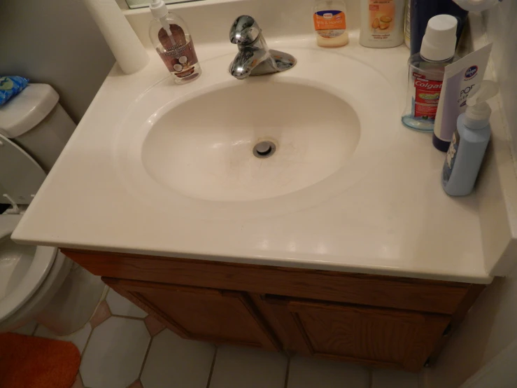 this bathroom features white tile and a white sink