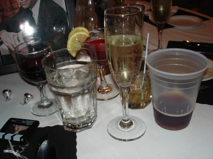 a table is filled with glasses and wine on the table