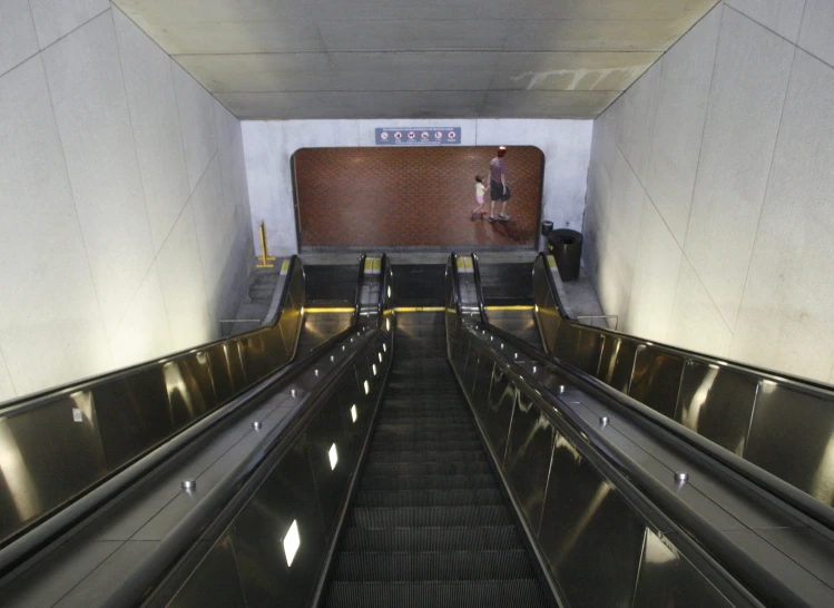 the conveyor belt has steps up to it and is empty