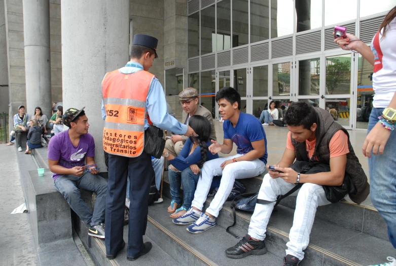 a group of people sitting and standing on steps