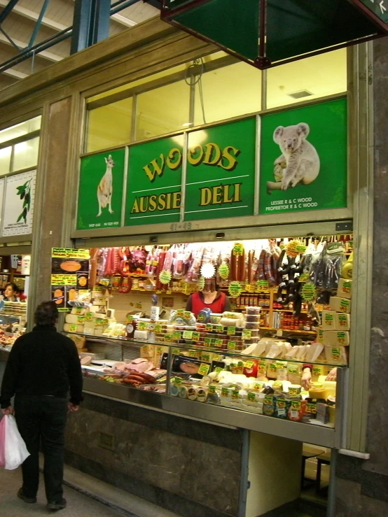 a person walking by a store with dog food