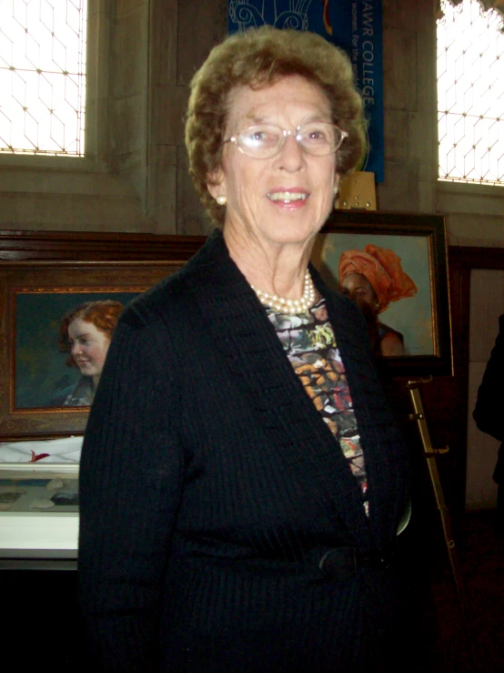 a older woman with glasses in a room