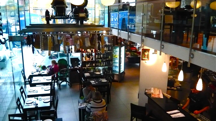 restaurant tables and chairs are arranged in a large area