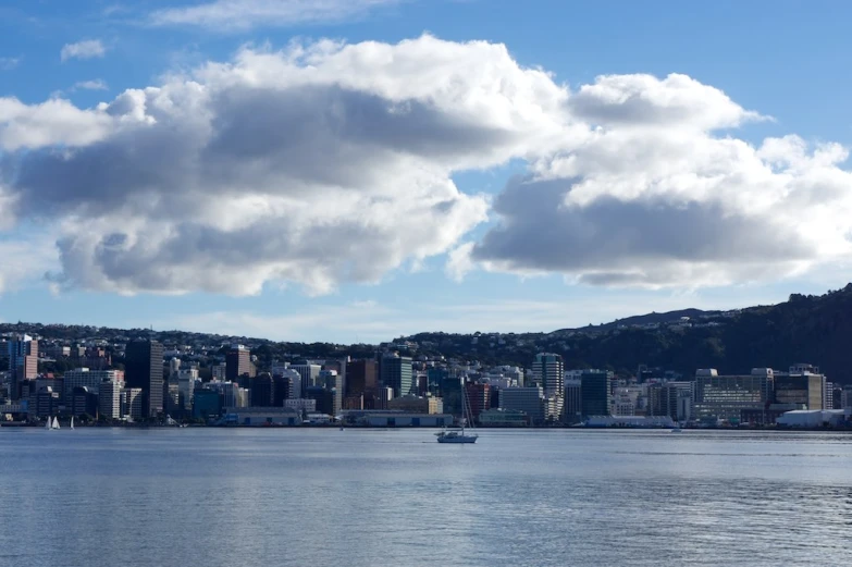 a city on the coast with a boat in it