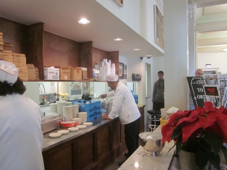 chefs in the kitchen preparing a meal