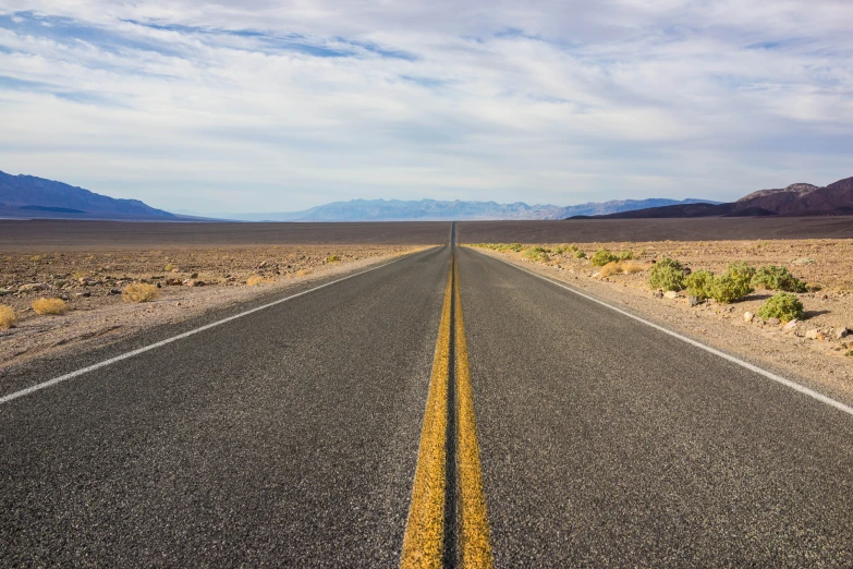 a empty highway stretches into the distance