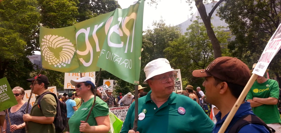 people with signs at a rally holding signs