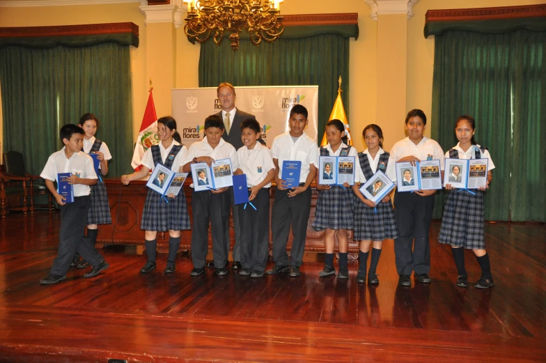 a large group of s holding framed pos