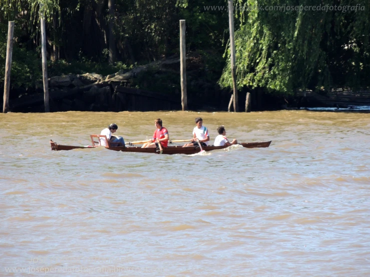 a group of people that are in a boat on the water