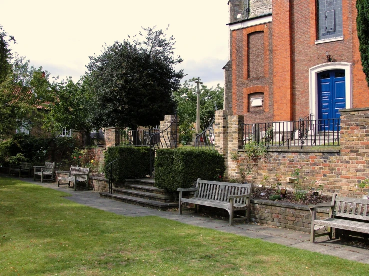 a row of benches on the side of a street