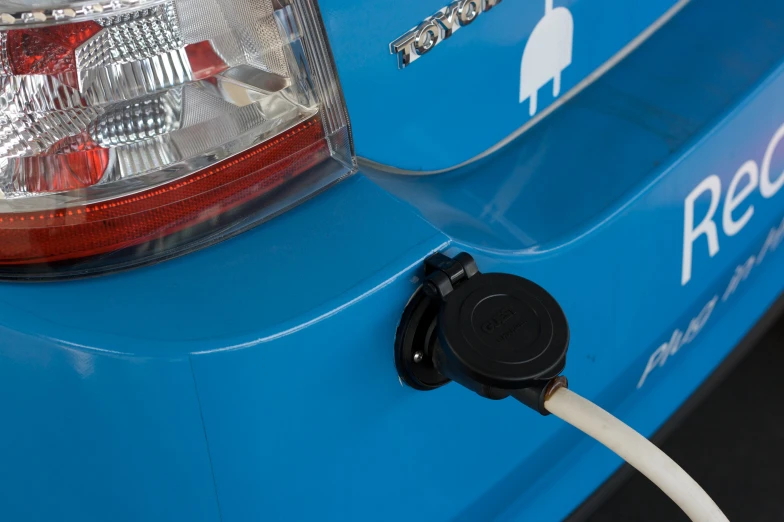 the back end of an electric vehicle that has an outlet attached