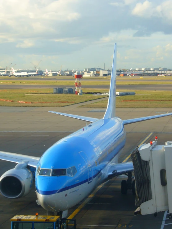 an airplane that is at the gate on a runway