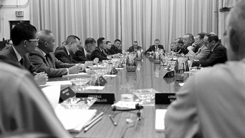 a group of people that are sitting around a table