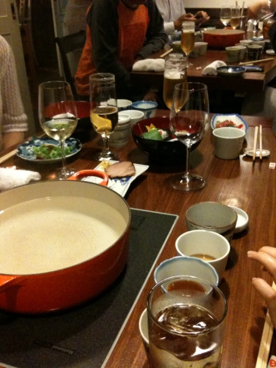 a group of people eating dinner at a table