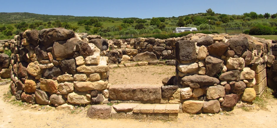 a stone house with two doors and two stone steps