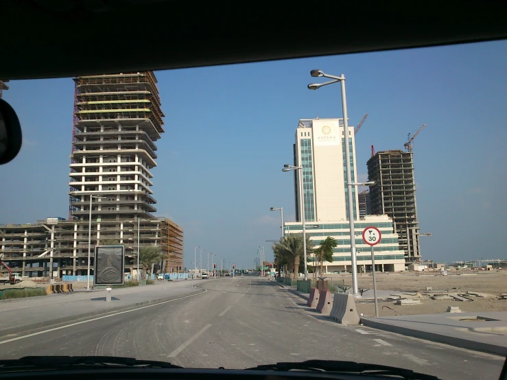 there is a view of tall buildings behind the vehicle