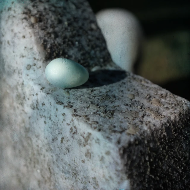 a stone statue with a light in it